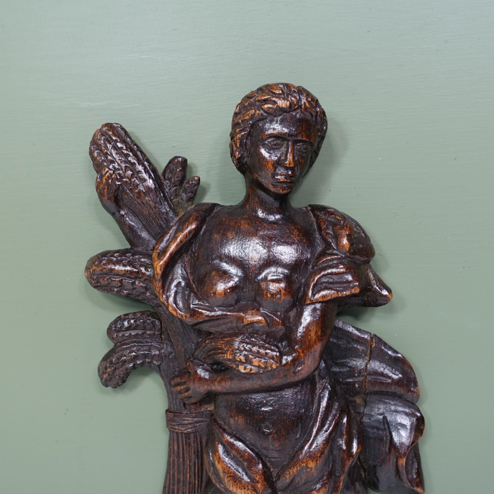 EARLY 18TH C CARVED OAK F IGURE View II