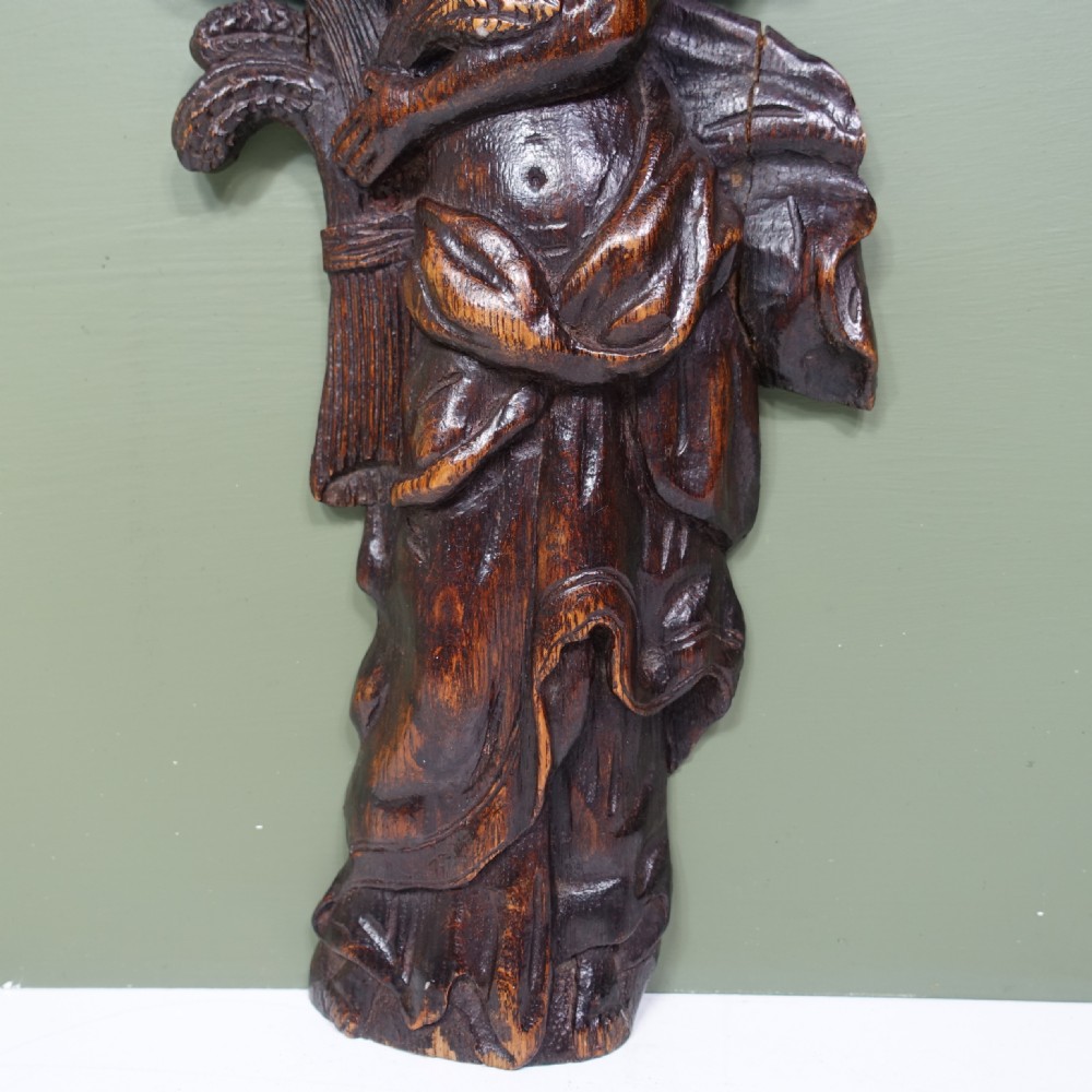 EARLY 18TH C CARVED OAK F IGURE View III