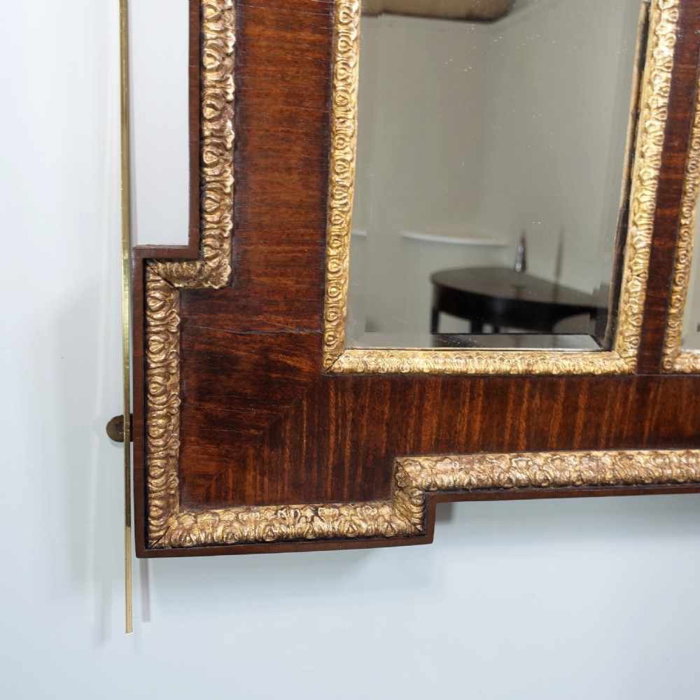 A large 19th-century rectangular walnut overmantel mirror featuring three bevelled glass plates and giltwood trim. View III