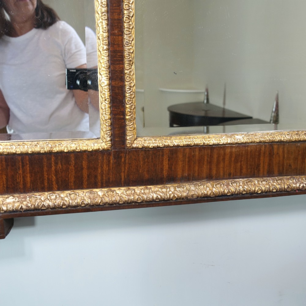 A large 19th-century rectangular walnut overmantel mirror featuring three bevelled glass plates and giltwood trim. View IV