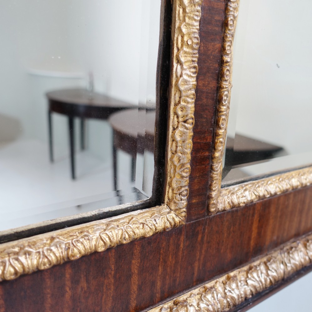A large 19th-century rectangular walnut overmantel mirror featuring three bevelled glass plates and giltwood trim. View V