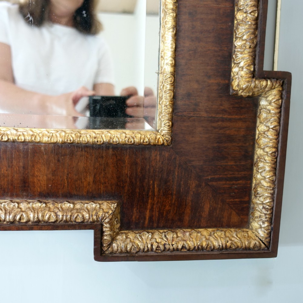 A large 19th-century rectangular walnut overmantel mirror featuring three bevelled glass plates and giltwood trim. View VI