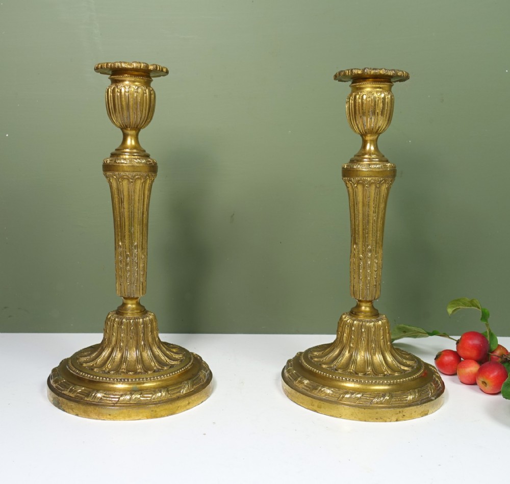 PAIR OF EARLY 19TH C ORMOLU CANDLESTICKS