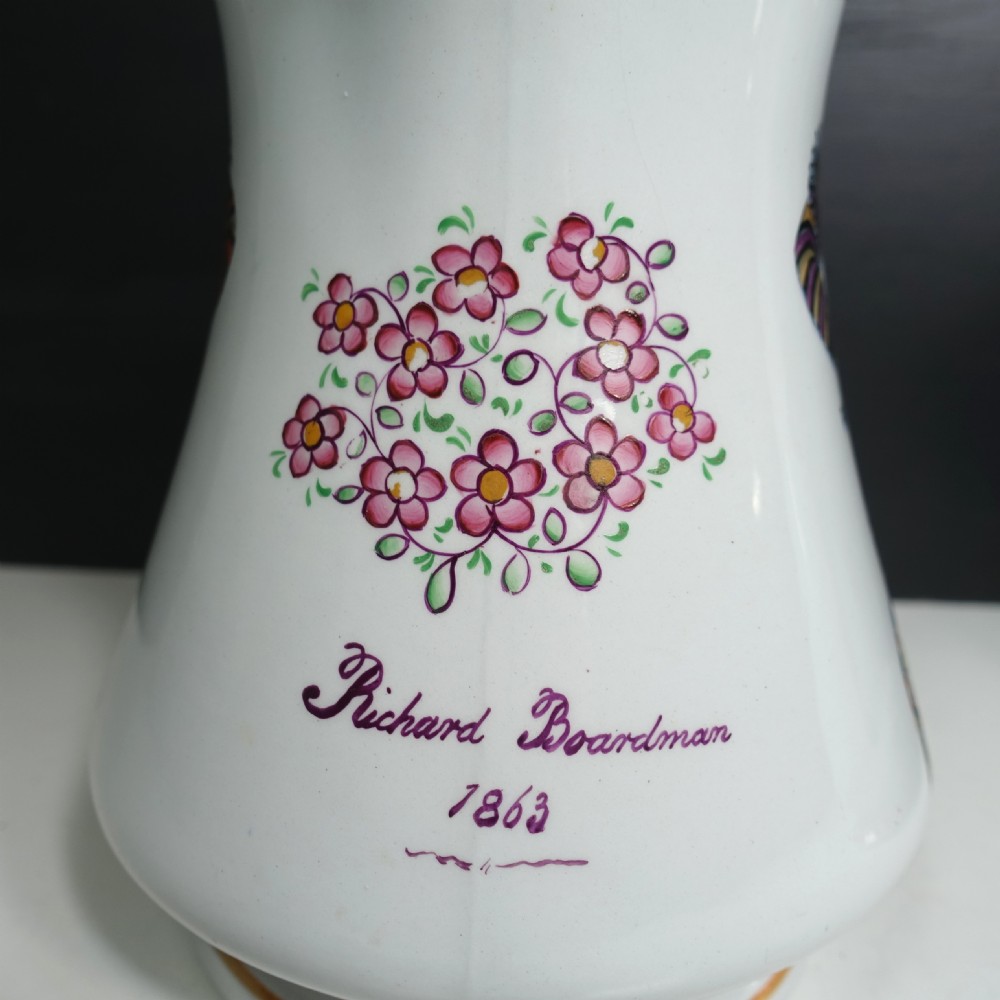 A pair of white Victorian ironstone puzzle jugs featuring hand-painted jester figures in colourful attire. View VIII