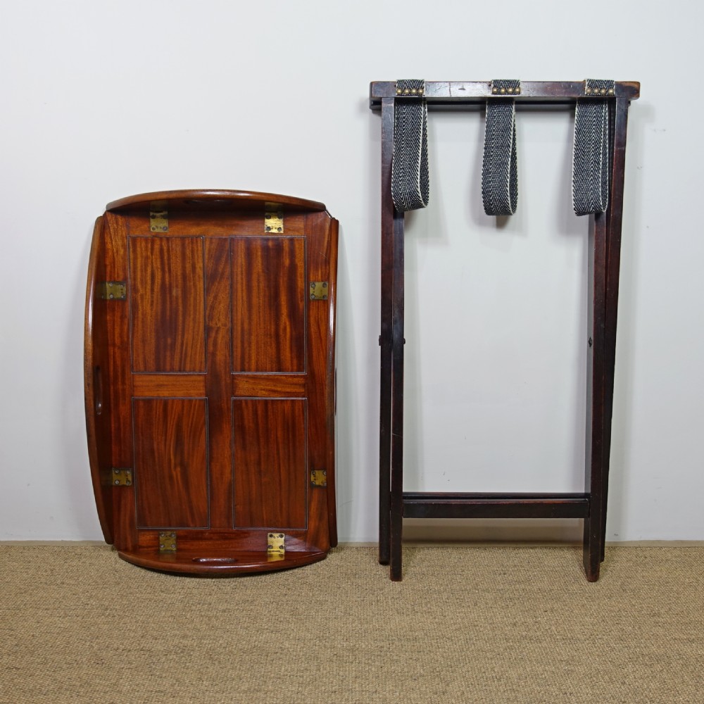 A George III mahogany butlers tray with hinged gallery sides resting on a folding cross-frame stand. View VI
