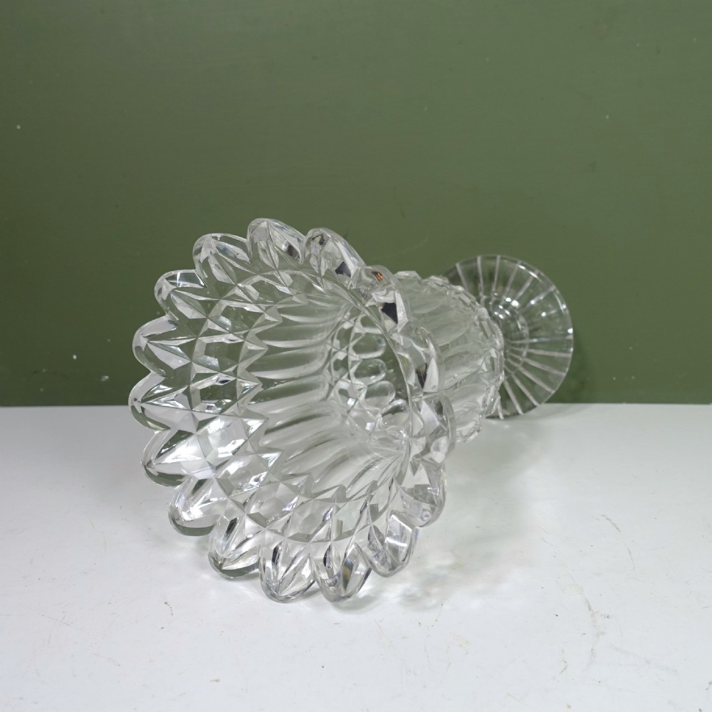 A 19th-century clear cut glass vase featuring a flared scalloped rim, geometric diamond patterns, fluted sides, and a stemmed pedestal base. View III