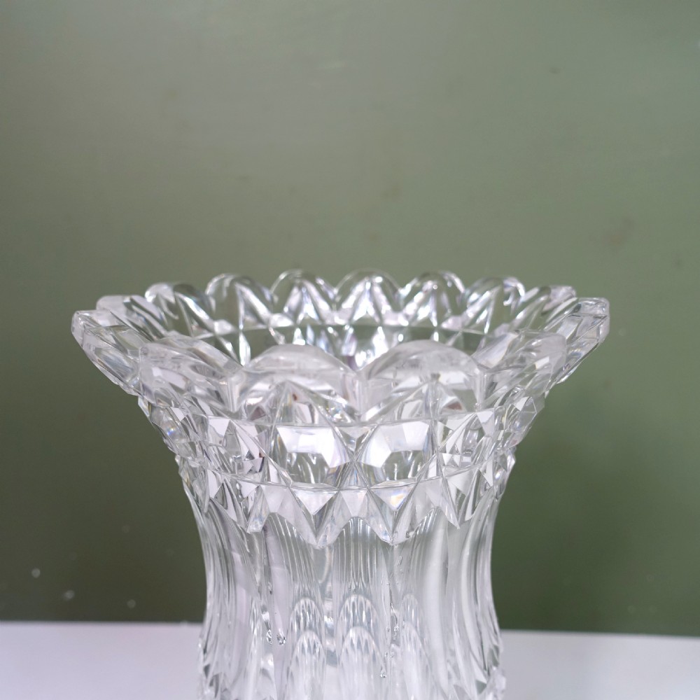 A 19th-century clear cut glass vase featuring a flared scalloped rim, geometric diamond patterns, fluted sides, and a stemmed pedestal base. View VII