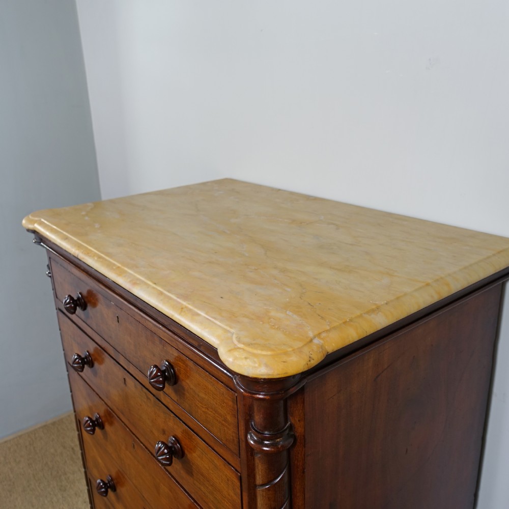 A 19th-century mahogany chest of drawers featuring six stacked drawers, turned wooden knobs, spiral twist side columns, and a smooth marble top. View V