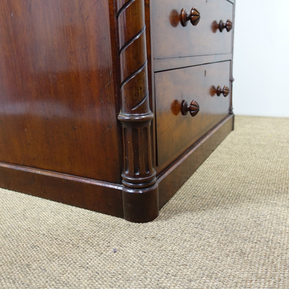 A 19th-century mahogany chest of drawers featuring six stacked drawers, turned wooden knobs, spiral twist side columns, and a smooth marble top. View VIII