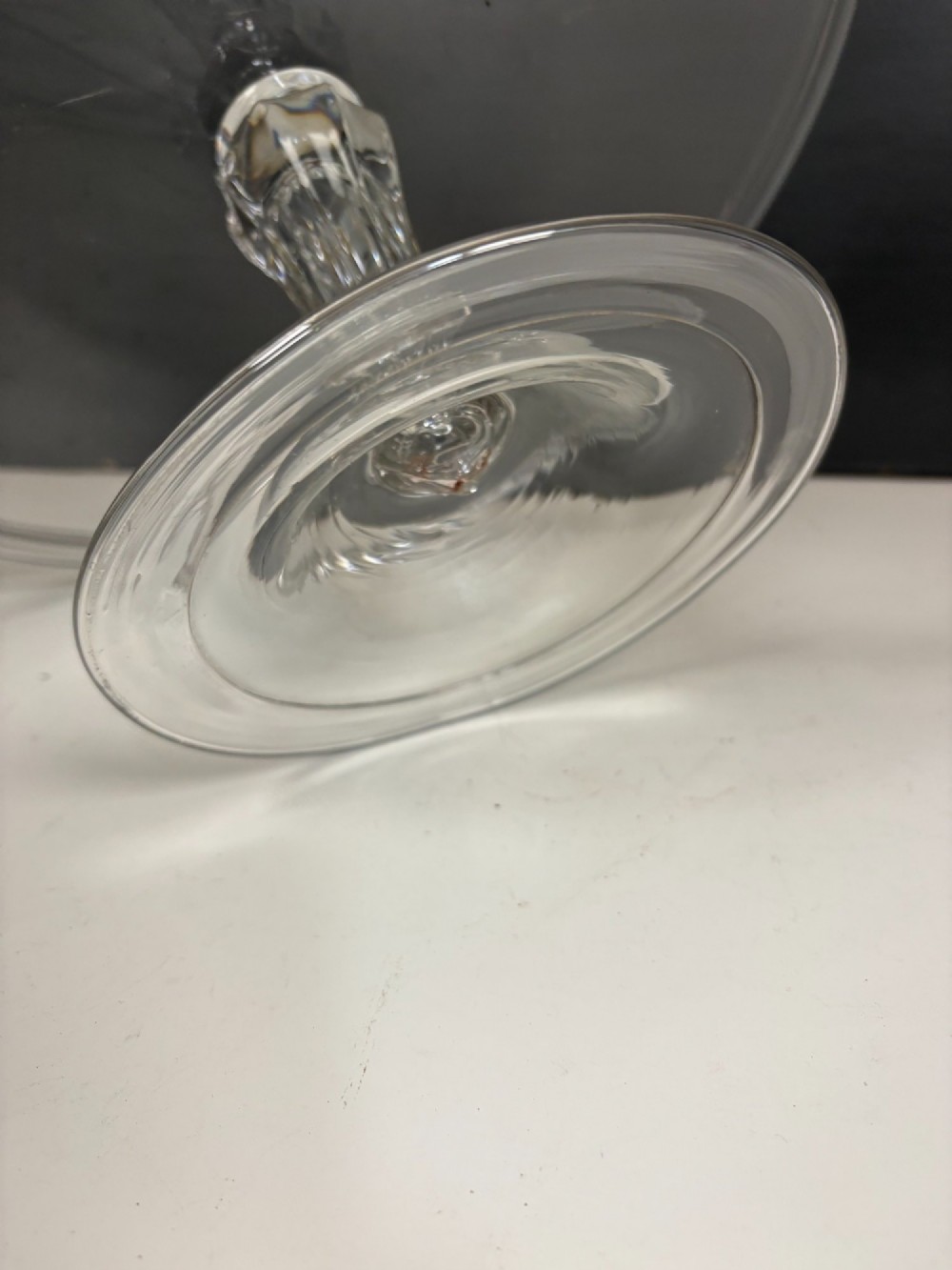 A clear glass George III tazza featuring a wide circular tray supported by a turned stem and a circular footed base. View V
