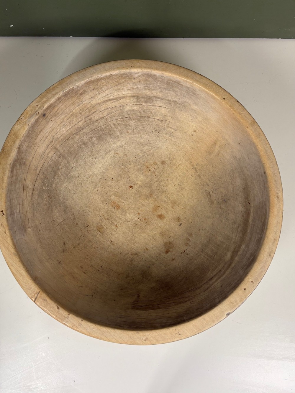 A nineteenth-century turned sycamore dairy bowl featuring horizontal scribed lines along the exterior and a naturally aged timber patina. View IV