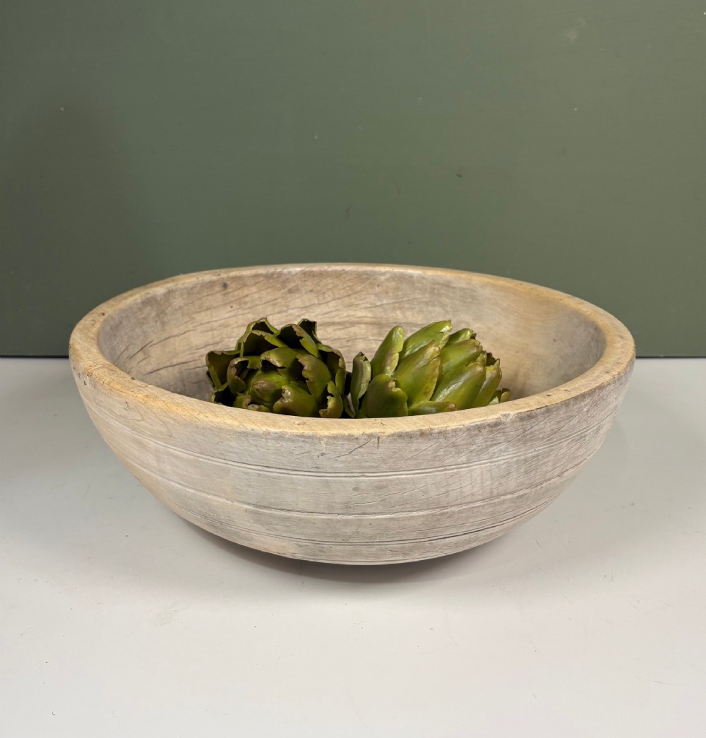 A nineteenth-century turned sycamore dairy bowl featuring horizontal scribed lines along the exterior and a naturally aged timber patina. View VI