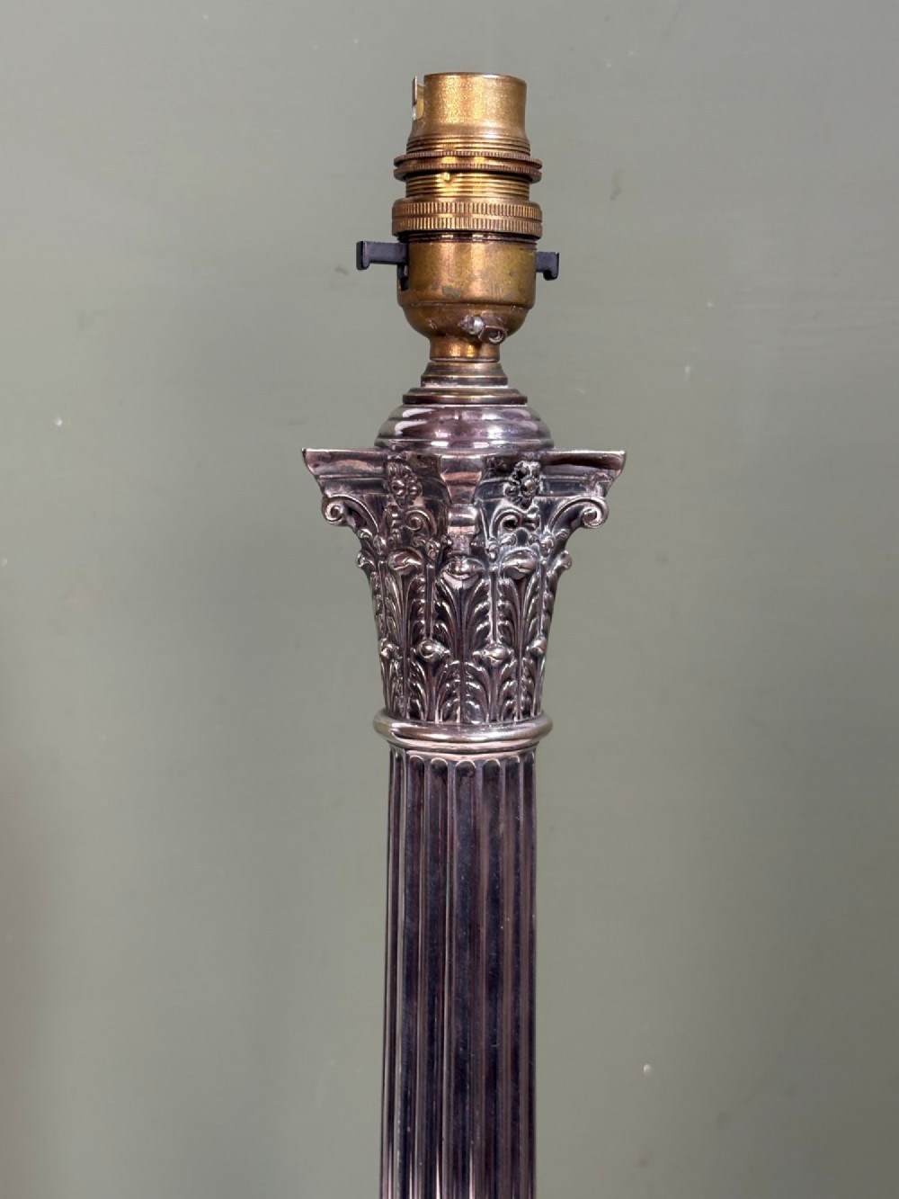 A 19th-century silver-plated Corinthian column table lamp base featuring a fluted stem, detailed capital, and stepped square pedestal base. View III
