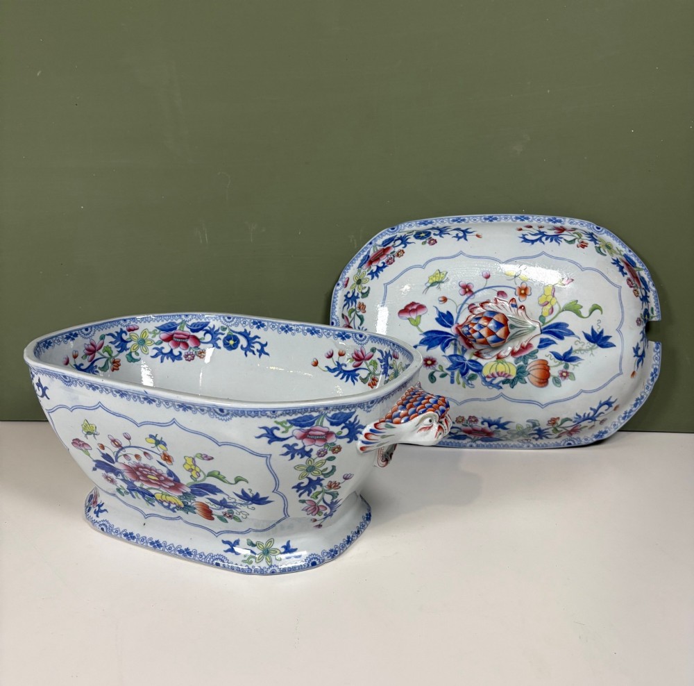 A nineteenth-century ceramic ironstone soup tureen with a patterned lid and matching undertray, decorated in polychrome floral chinoiserie motifs. View IV