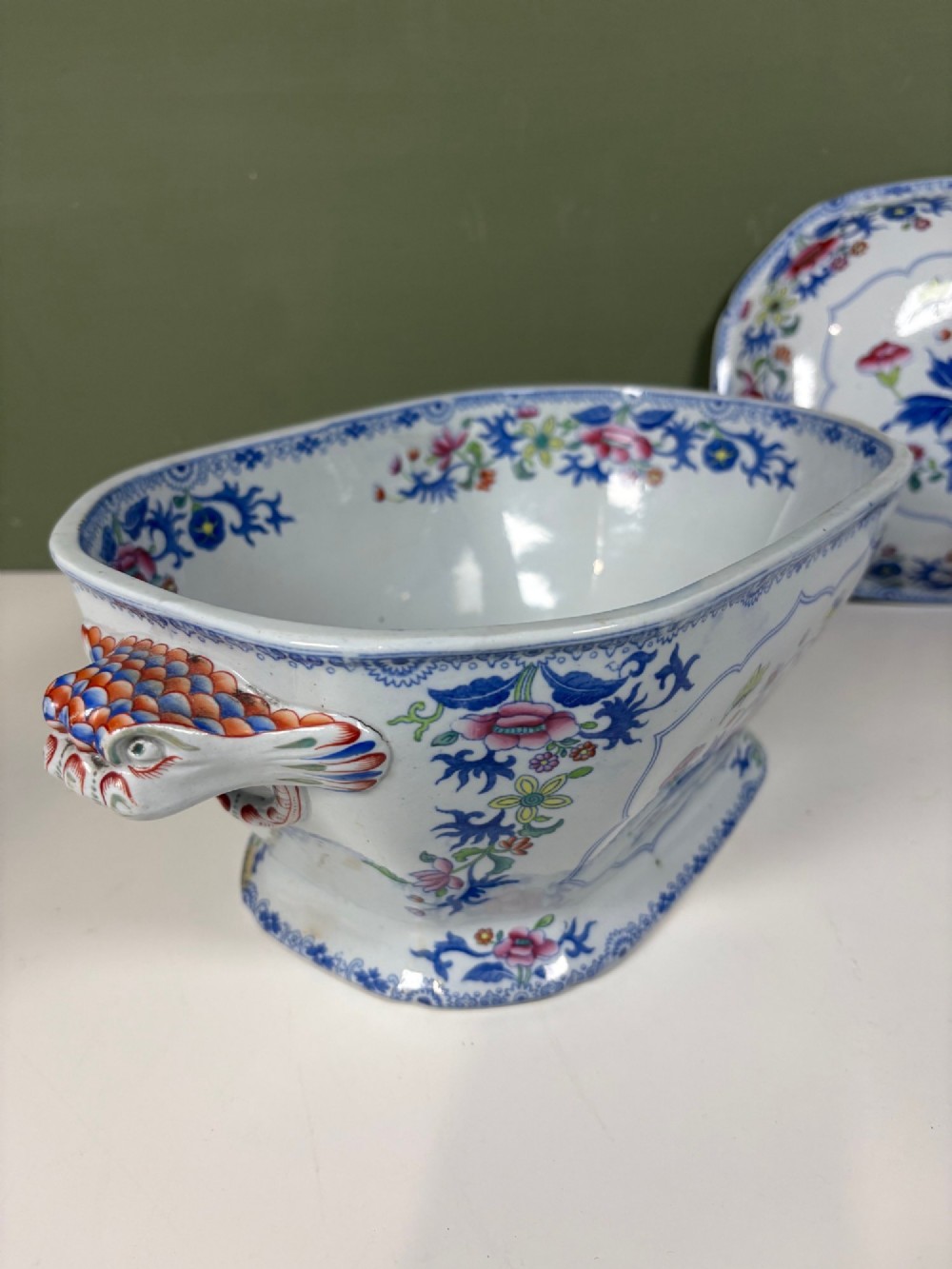A nineteenth-century ceramic ironstone soup tureen with a patterned lid and matching undertray, decorated in polychrome floral chinoiserie motifs. View V