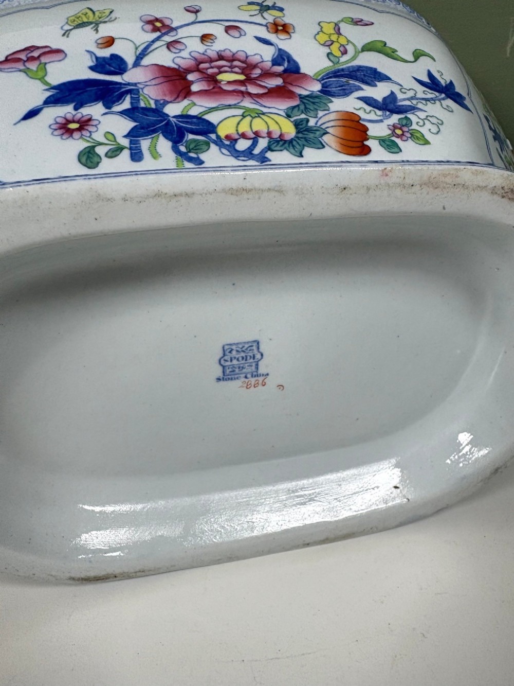 A nineteenth-century ceramic ironstone soup tureen with a patterned lid and matching undertray, decorated in polychrome floral chinoiserie motifs. View VI