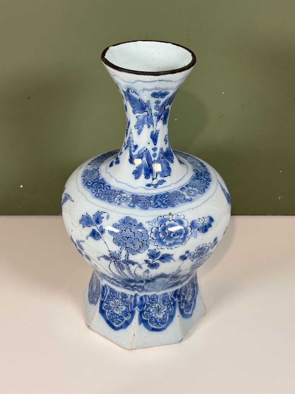 An 18th-century octagonal Delftware vase featuring hand-painted cobalt blue Chinoiserie figures and floral patterns against a white glaze. View III