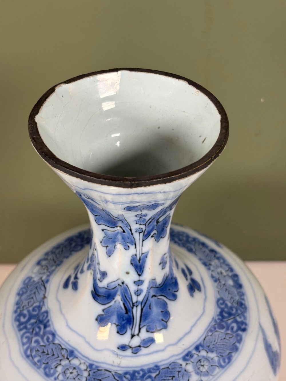An 18th-century octagonal Delftware vase featuring hand-painted cobalt blue Chinoiserie figures and floral patterns against a white glaze. View IV