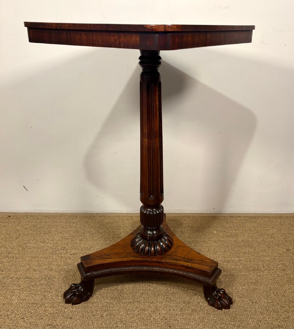 A nineteenth-century rosewood pedestal table featuring a square top, fluted central column, triform base, and carved claw feet. View III