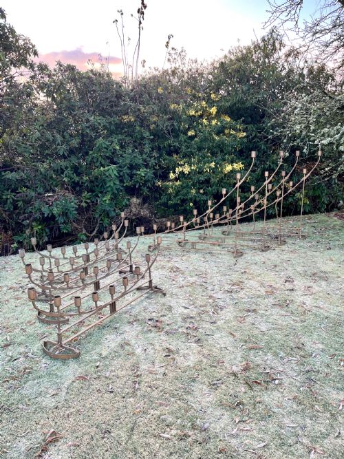 Eight Large Steel Candlesticks