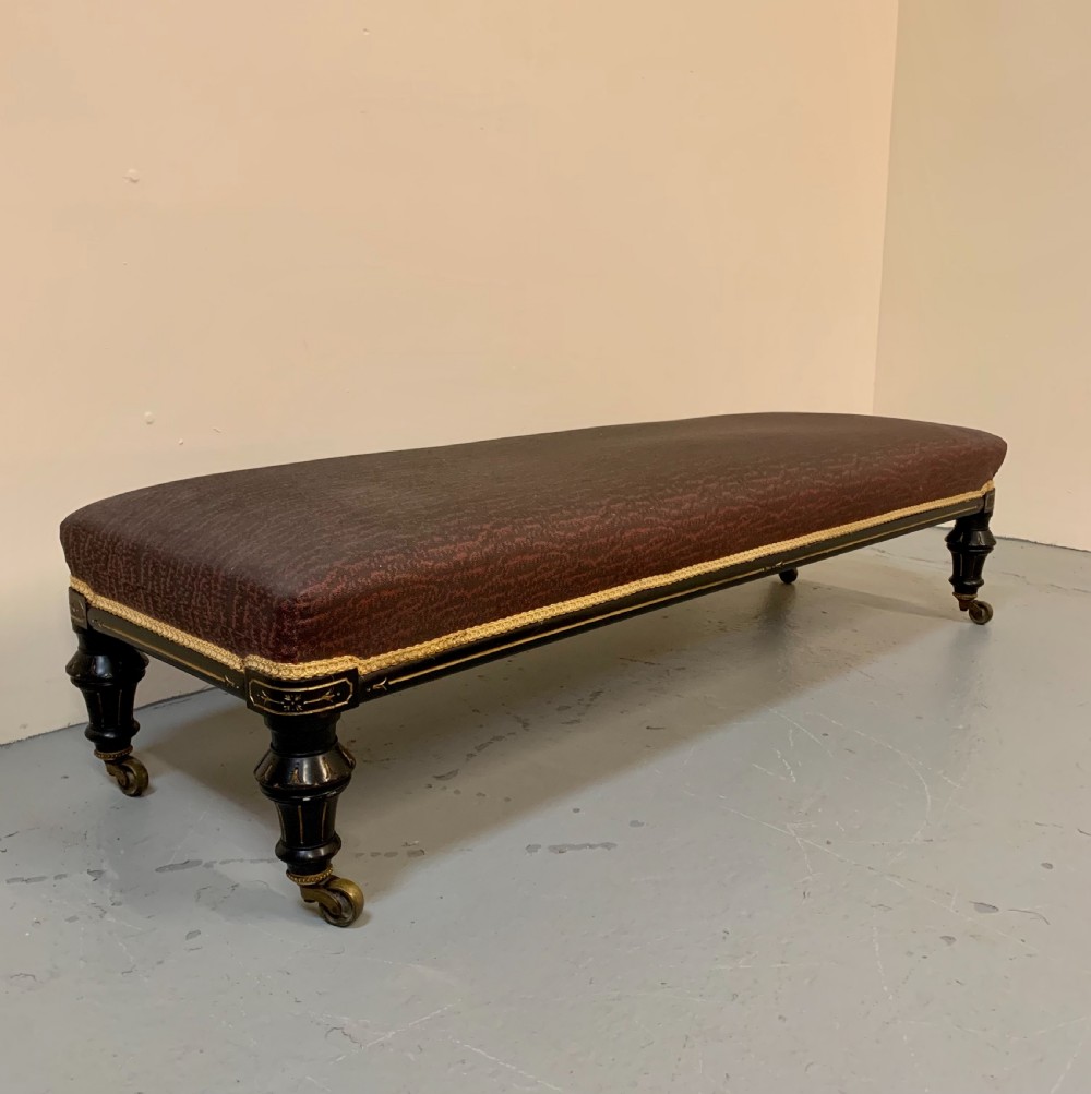 Large ebonised and gilded stool