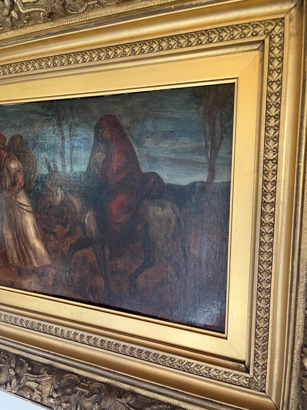An oil painting depicting a biblical narrative scene, presented inside a deeply moulded gold gilt picture frame. View II