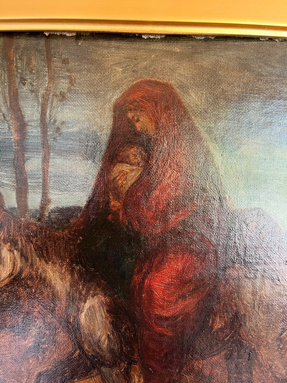 An oil painting depicting a biblical narrative scene, presented inside a deeply moulded gold gilt picture frame. View X