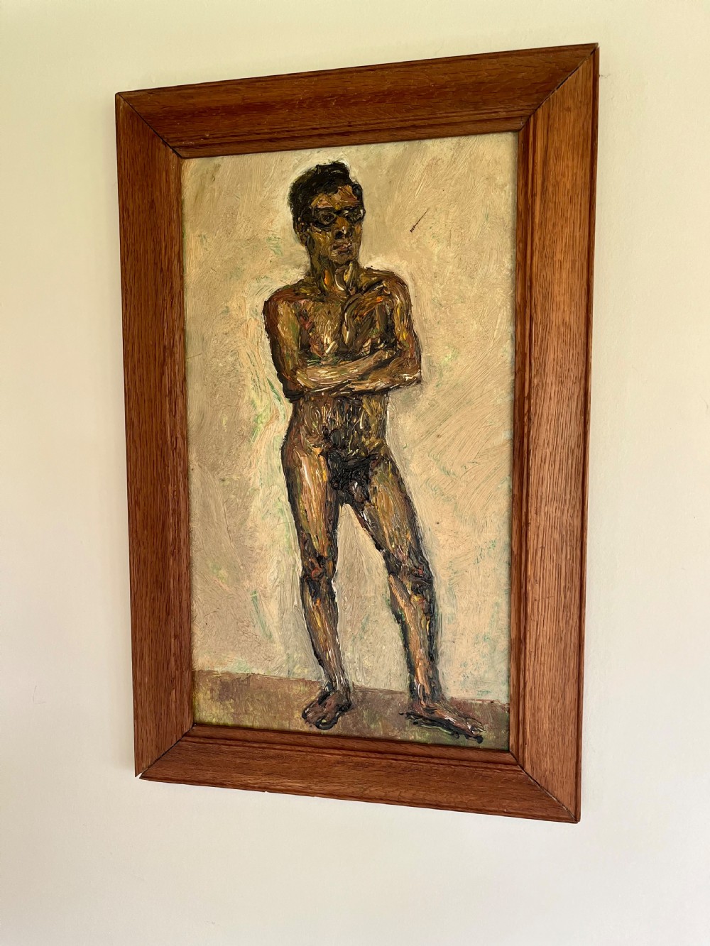 A framed expressionist oil painting depicting a standing male nude figure with crossed arms rendered in thick impasto paint. View II