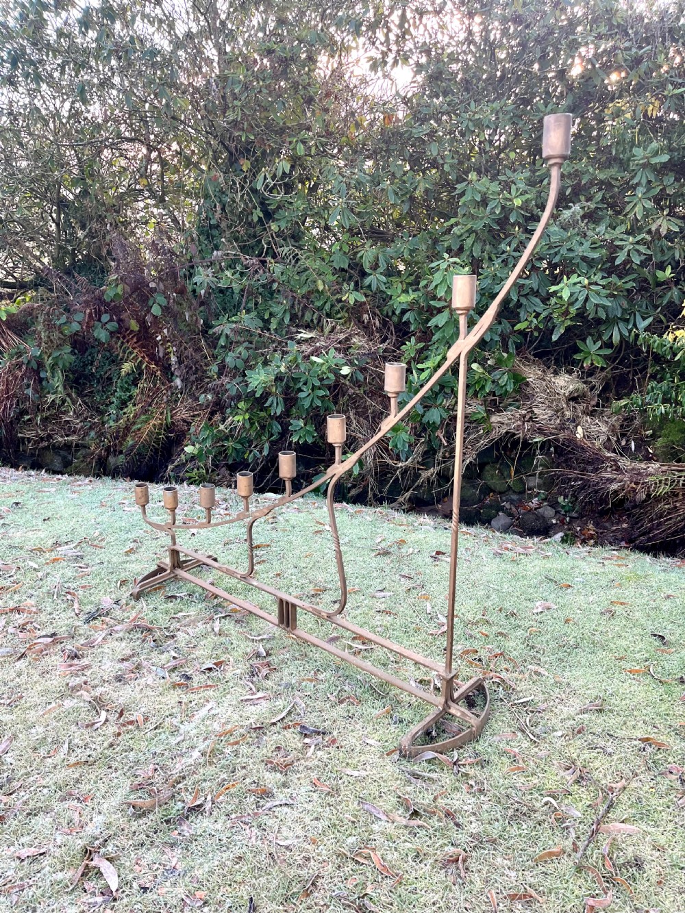 Eight large steel candlesticks  View X