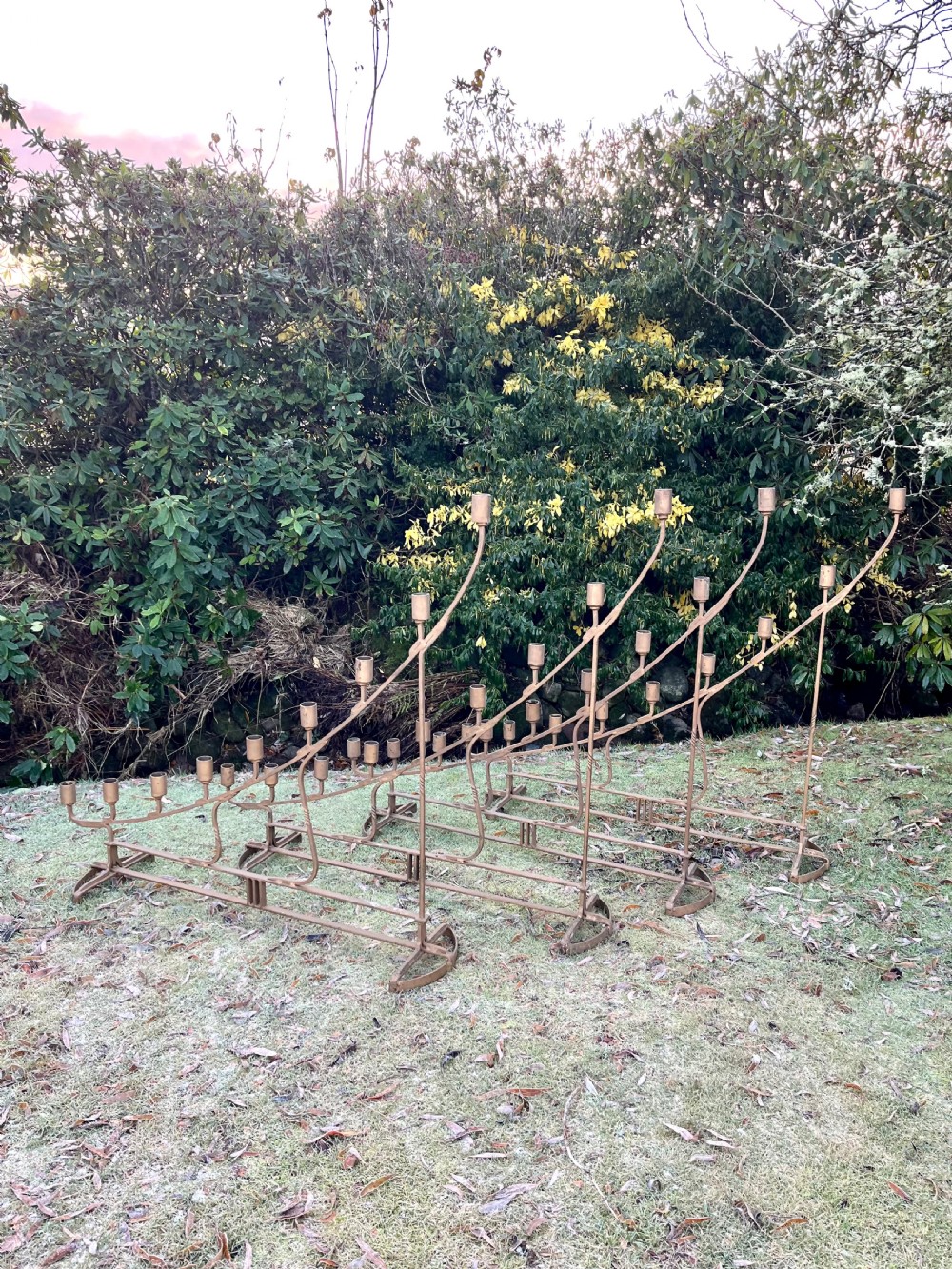 Eight large steel candlesticks  View XV