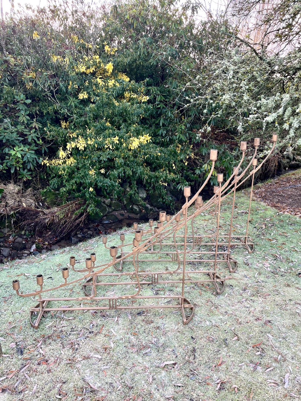 Eight large steel candlesticks  View XVIII