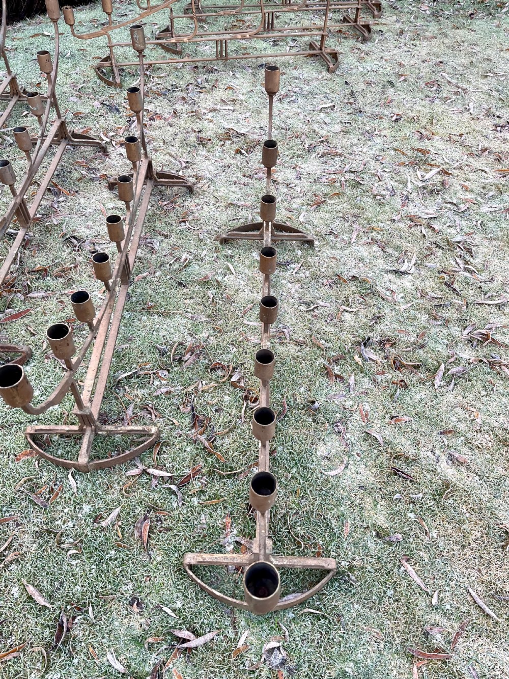 Eight large steel candlesticks  View XIX