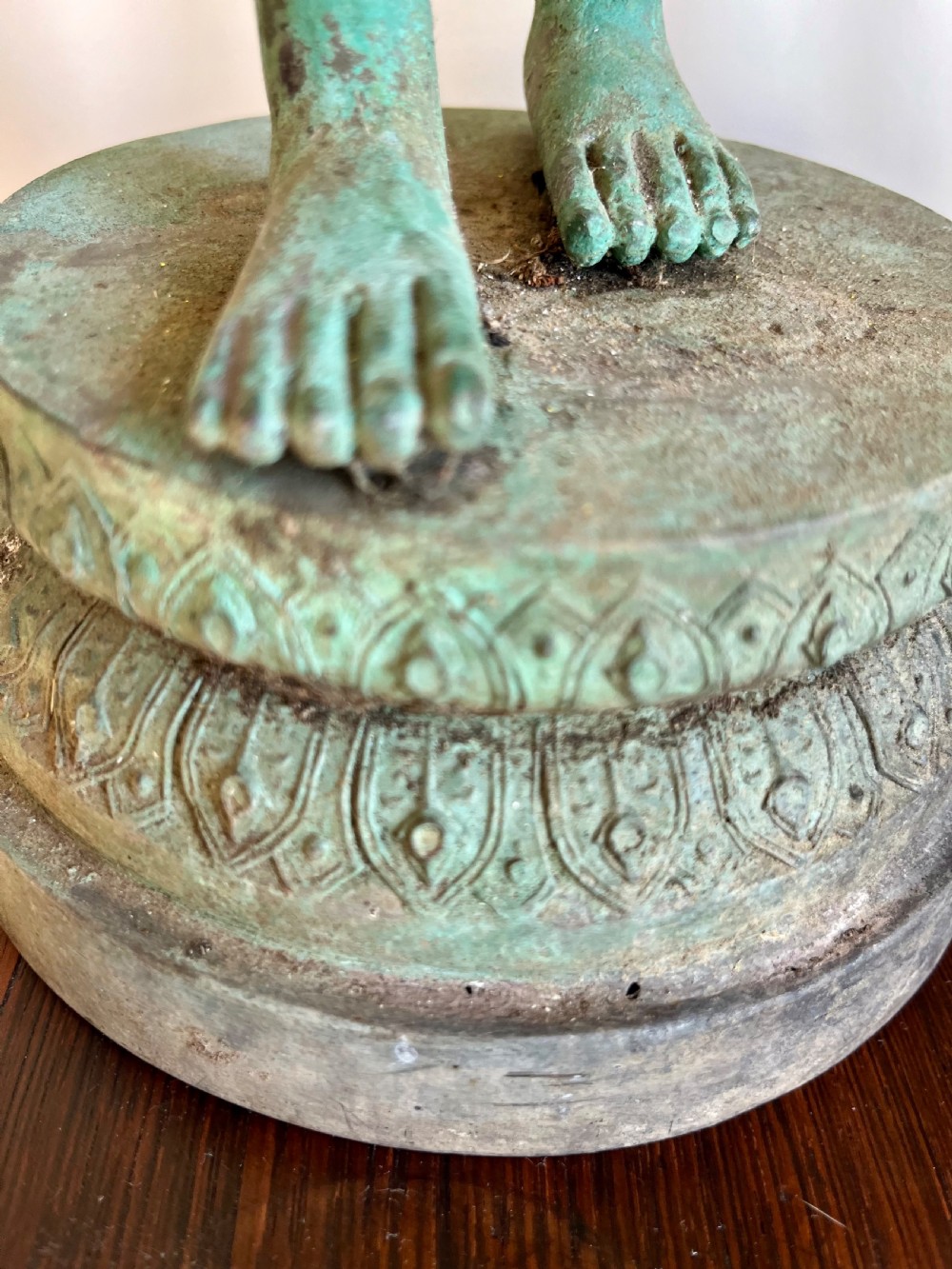 A pair of full-length bronze statues depicting a standing male and female figure with a green verdigris patina, positioned on rounded carved bases. View V