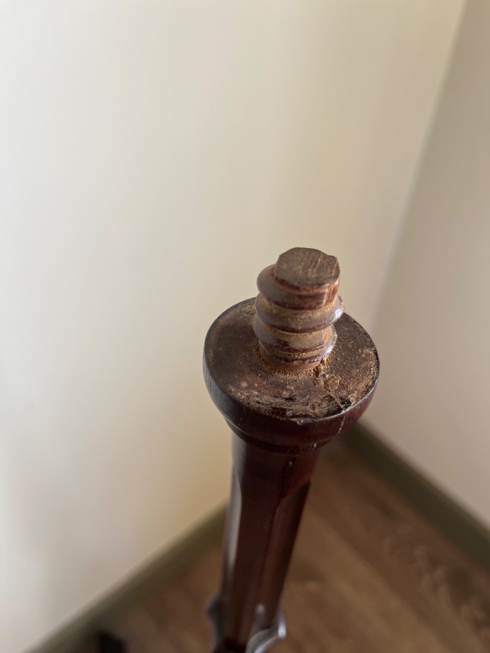 A dark mahogany torchere plant stand featuring a scalloped circular top, a turned column shaft, and a tripod base with scrolled feet. View VIII