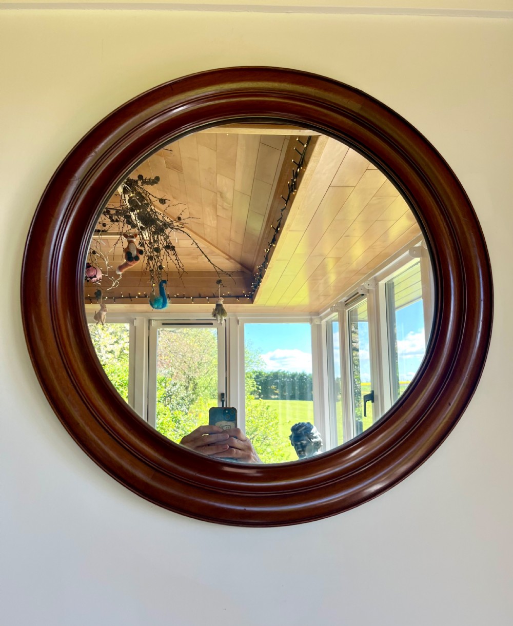 Large circular mahogany wall mirror 