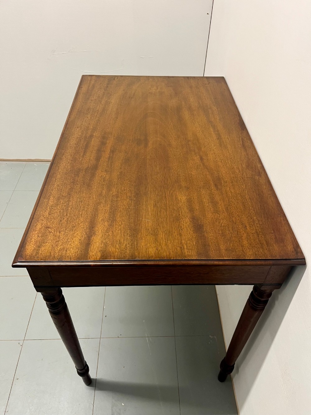 A Scottish Regency mahogany side table featuring two frieze drawers with brass handles and slender turned legs. View III