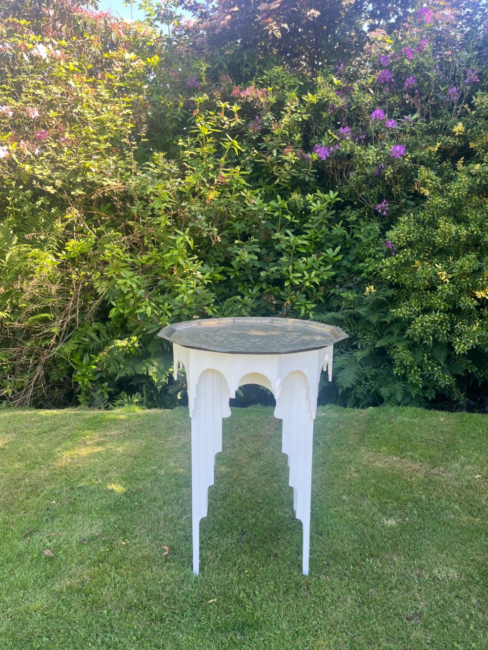 A white painted Moorish style occasional table featuring stepped horseshoe arches and a dark contrasting tray top. View V