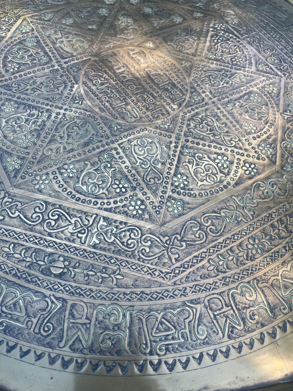 A white painted Moorish style occasional table featuring stepped horseshoe arches and a dark contrasting tray top. View VIII