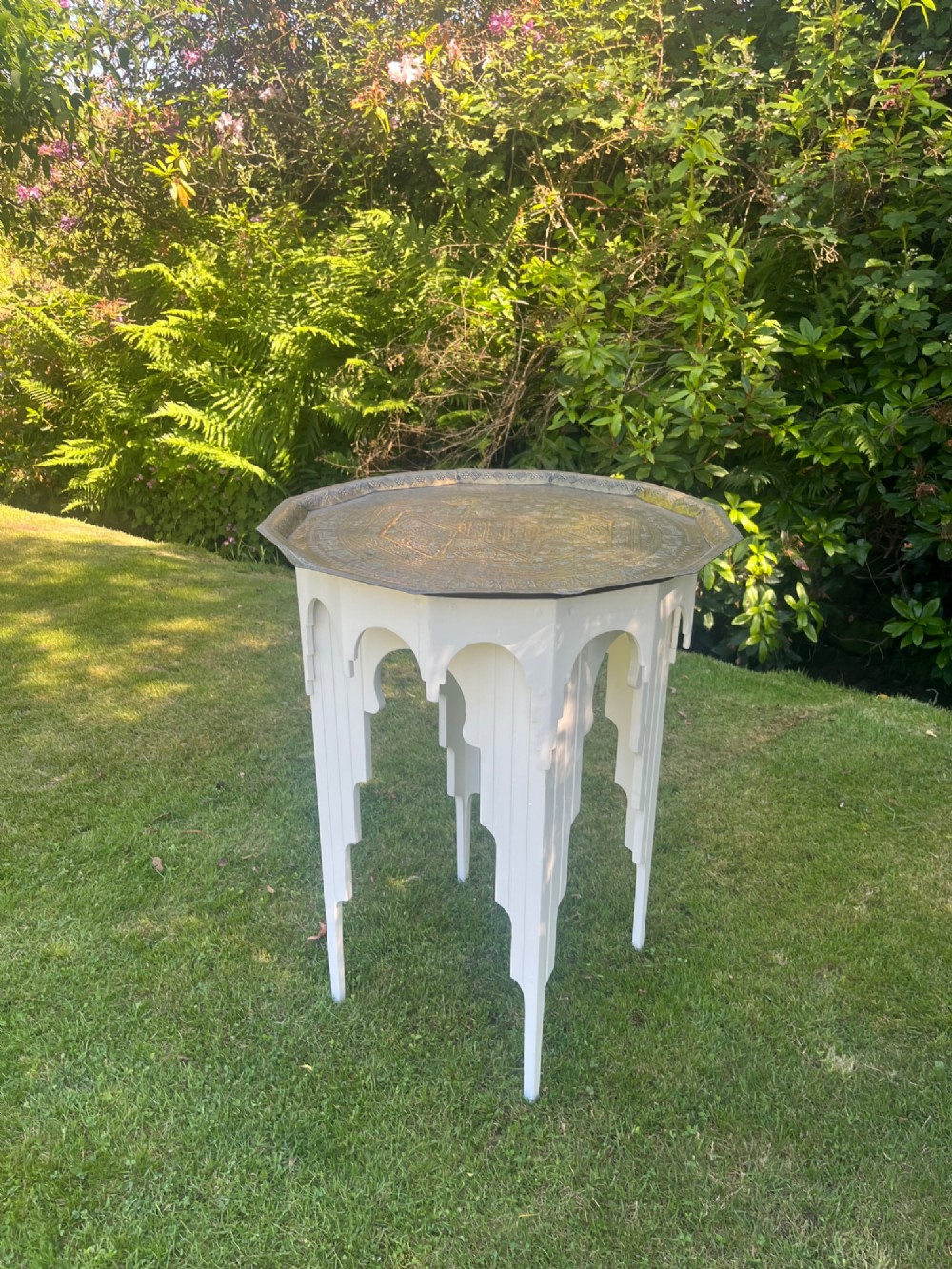 A white painted Moorish style occasional table featuring stepped horseshoe arches and a dark contrasting tray top. View XIII