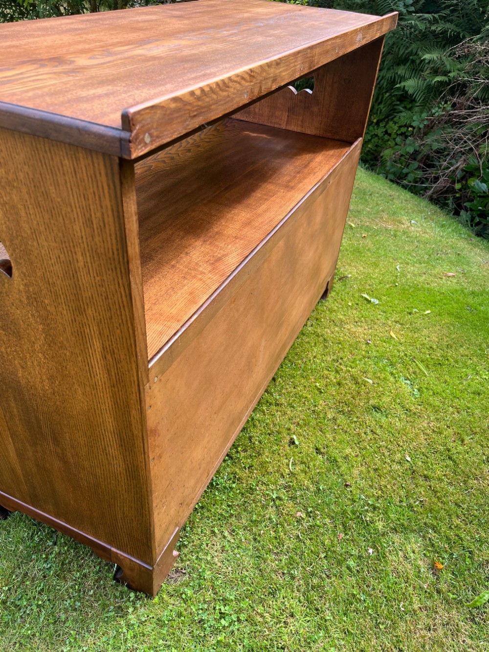 An elm wood side cabinet with an open upper shelf and four drawers featuring integrated wooden handles. View XII