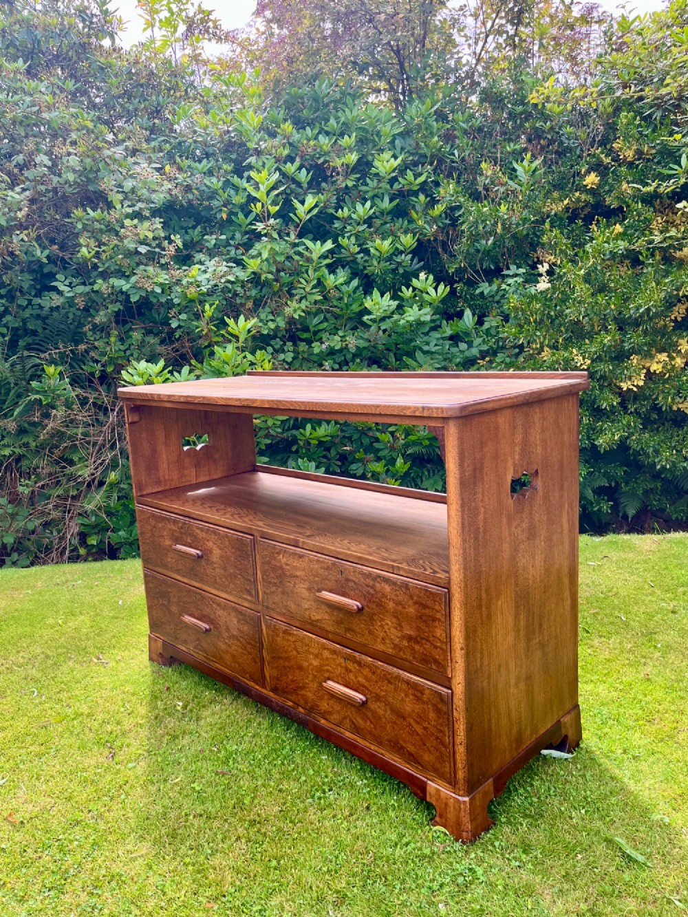 An elm wood side cabinet with an open upper shelf and four drawers featuring integrated wooden handles. View XIII