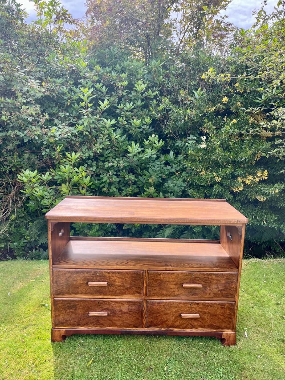 An elm wood side cabinet with an open upper shelf and four drawers featuring integrated wooden handles. View XIV