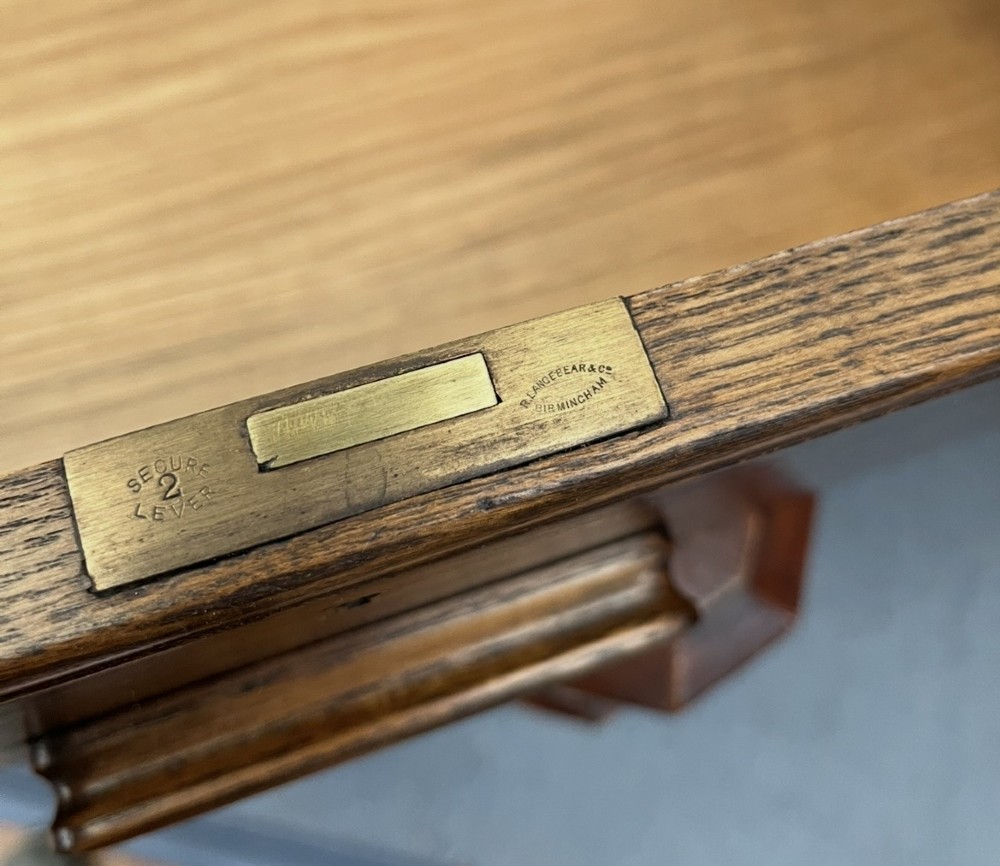 An elm wood side cabinet with an open upper shelf and four drawers featuring integrated wooden handles. View XV