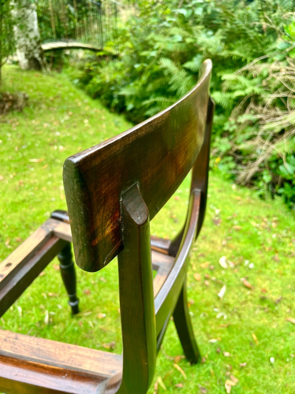 A pair of dark brown laburnum wooden side chairs featuring turned front legs, curved top rails, and open frames for drop-in seats. View XI