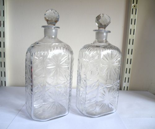 A PAIR OF 18TH CENTURY CUT GLASS SPIRIT DECANTERS