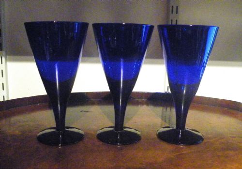A SET OF THREE LARGE ANTIQUE BRISTOL BLUE GLASS GOBLETS