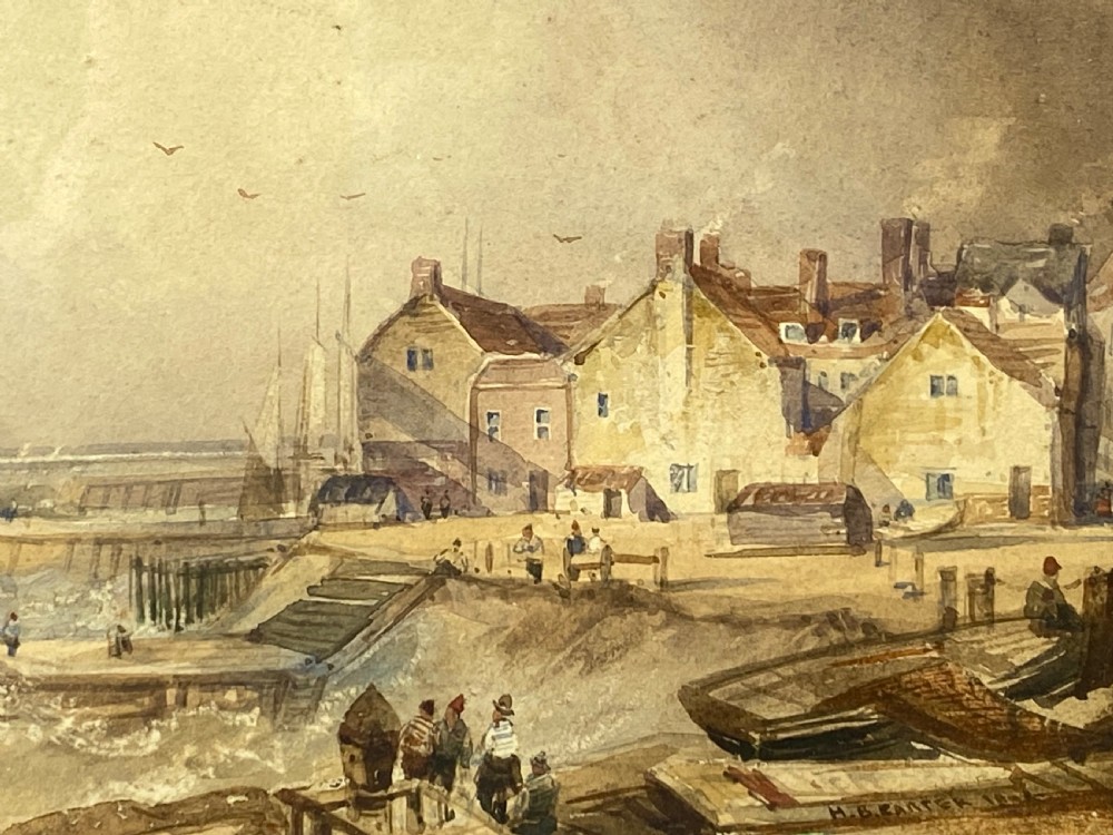 A 19th-century watercolour painting depicting a coastal town and harbour scene with rough seas, set inside a heavy gold gilt scrollwork frame. View III