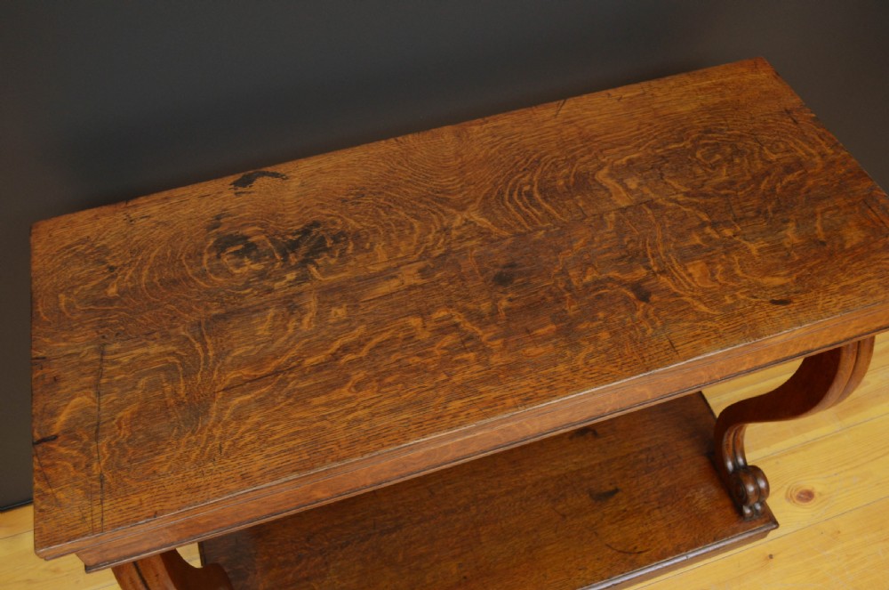 Victorian oak console table featuring a smooth rectangular top, curved scroll legs, and a solid lower plinth base. View IV
