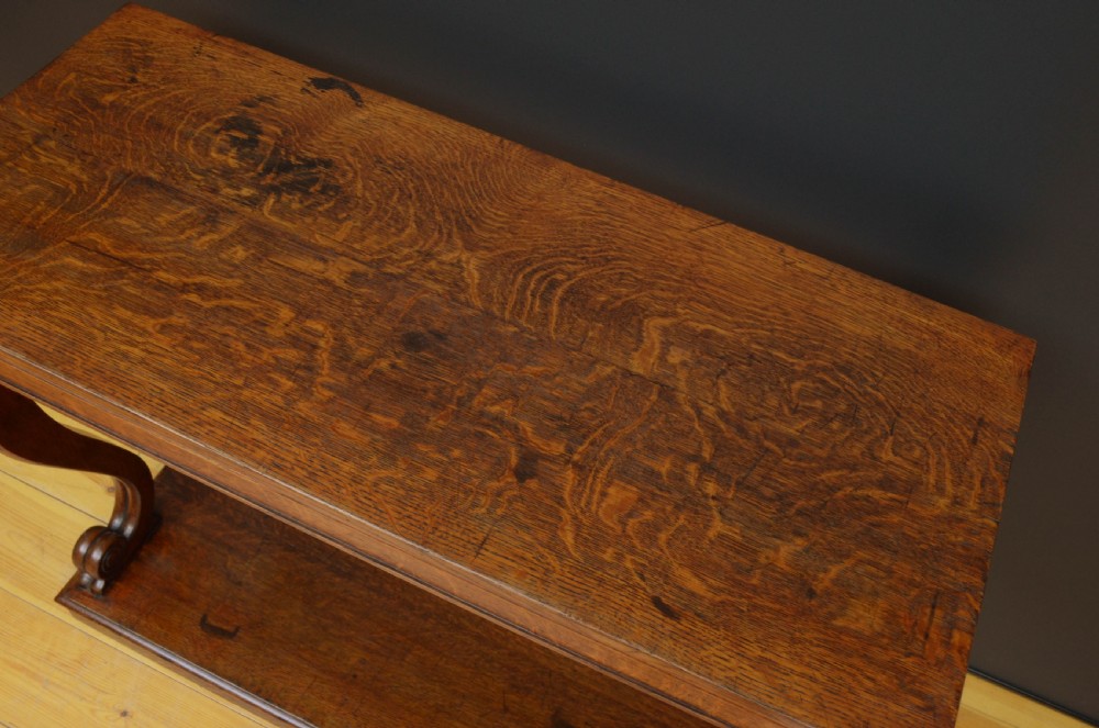Victorian oak console table featuring a smooth rectangular top, curved scroll legs, and a solid lower plinth base. View V
