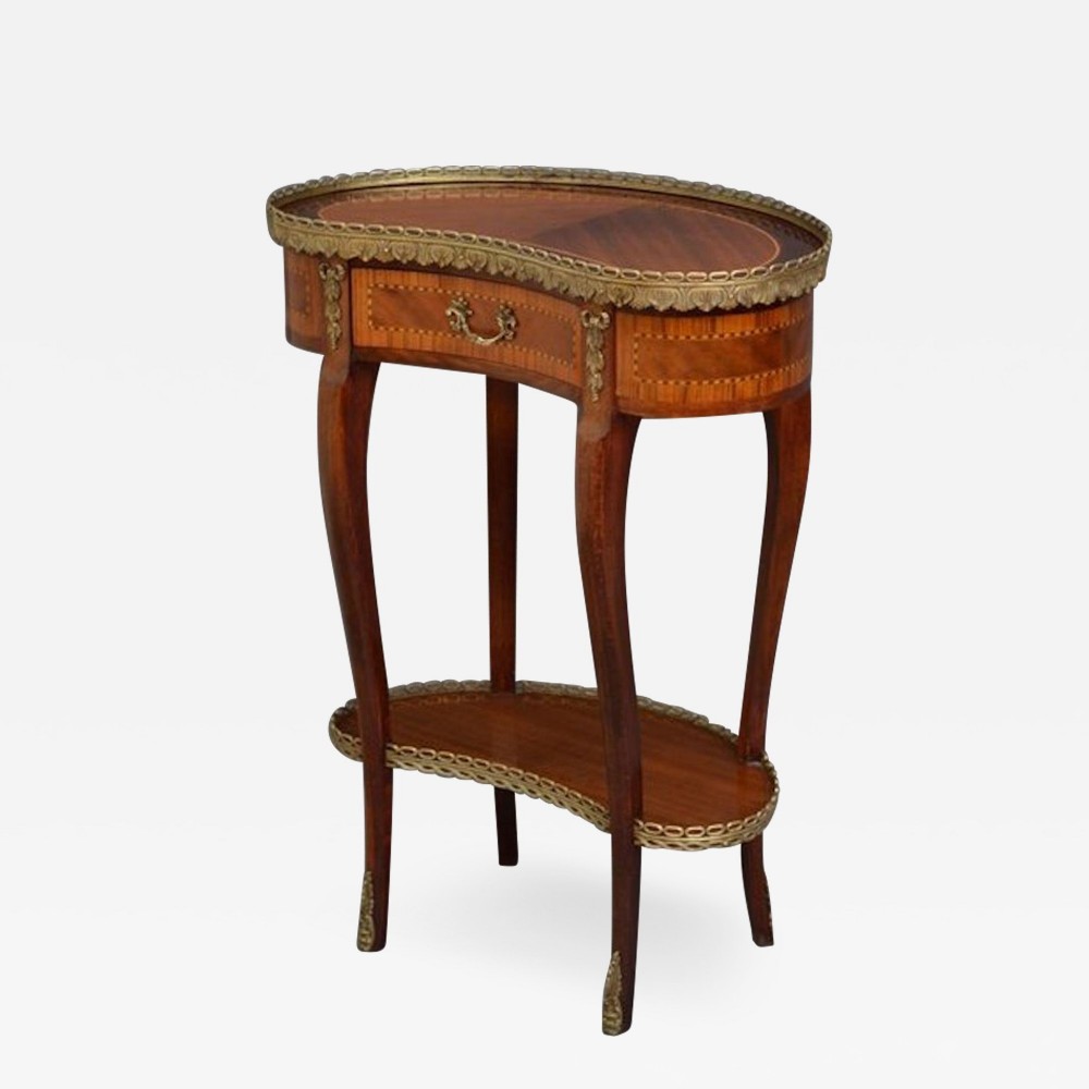 A French-style kidney-shaped occasional table featuring cabriole legs, marquetry wood veneer, a lower tier, and a pierced brass gallery.